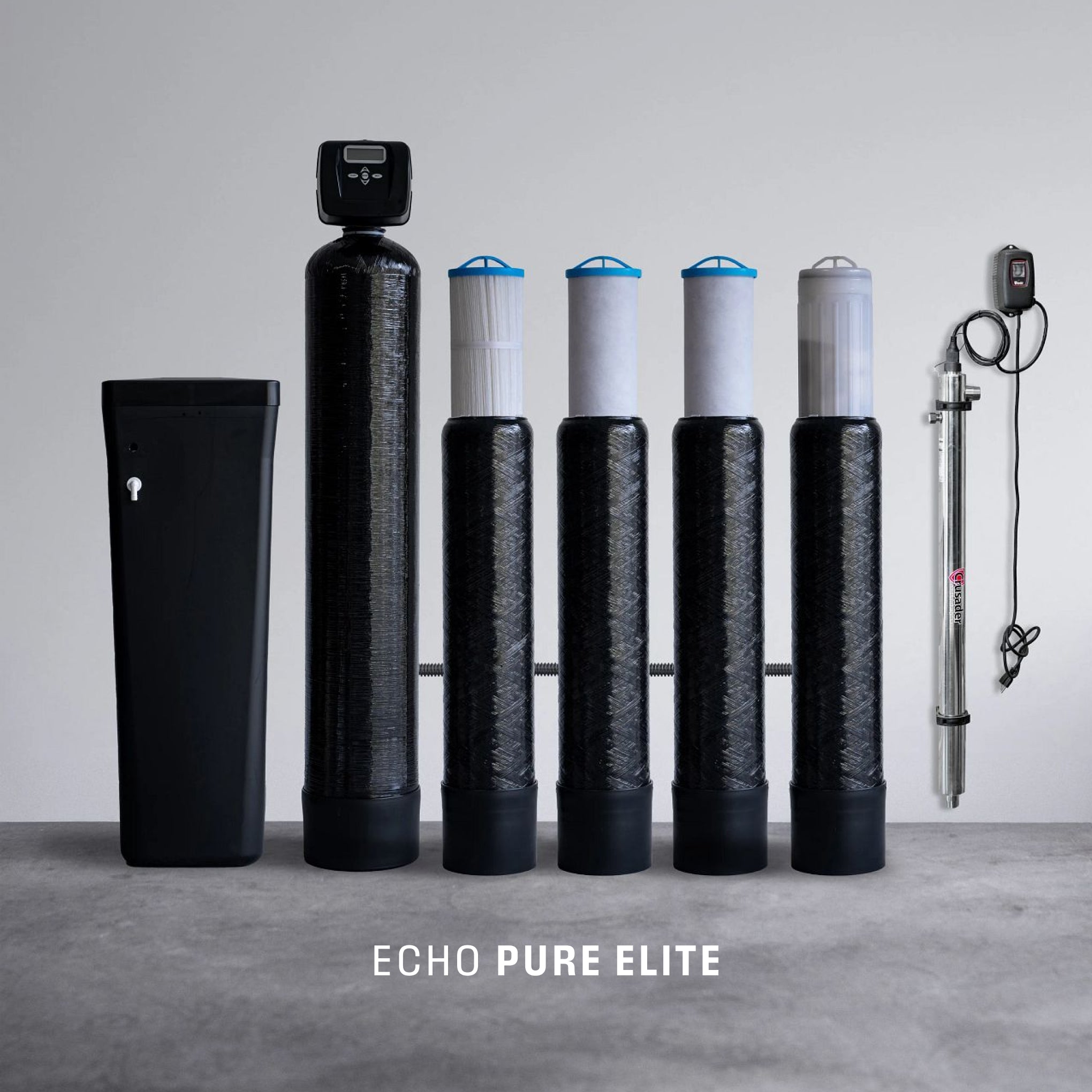 Whole house water filtration system with five black filter tanks, a clear UV filter, and softener unit.