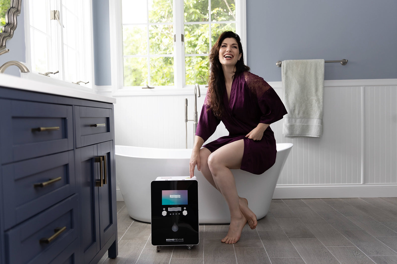 Woman sitting on the edge of a bathtub