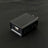Black USB wall charger block with single port on black background