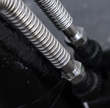 Close-up of stainless steel flexible hoses for hydrogen water filtration system