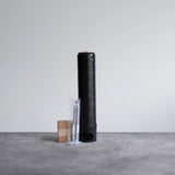 Replacement hydrogen water filter cartridge with installation kit on gray surface