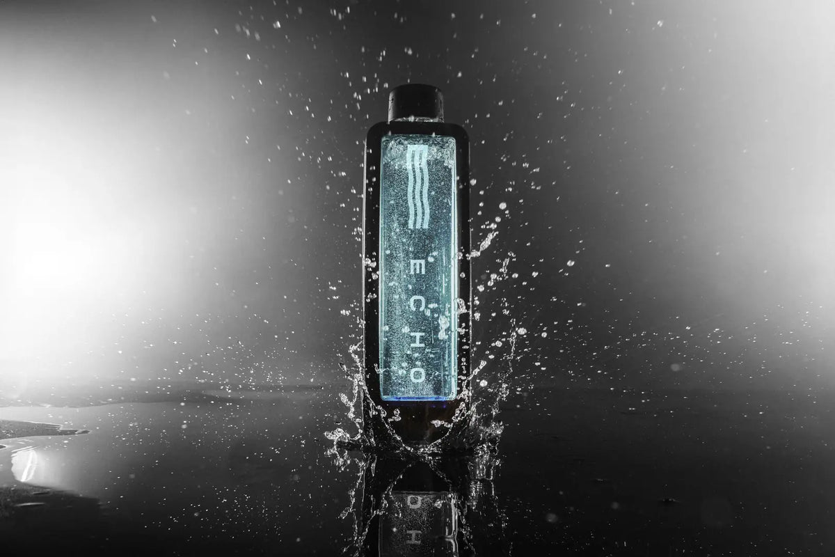 Modern hydrogen water bottle in black, splashing water, dramatic lighting