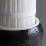 Close-up of hydrogen water filter cartridge with pleated filter membrane