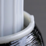 Close-up of hydrogen water filter cartridge inside a textured cylinder