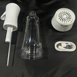 Hydrogen water generator parts: spray nozzle, clear bottle, device lid, and charging cable on black background.
