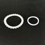 Two clear silicone sealing rings for water filter systems on black background