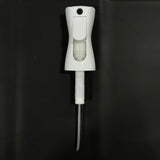 White plastic spray nozzle with tube on a black background, water sprayer accessory