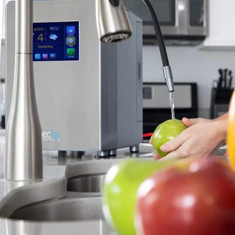 Washing produce with alkaline water at the kitchen sink