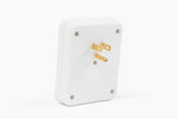 White electrical plug adapter with gold prongs on a plain white background