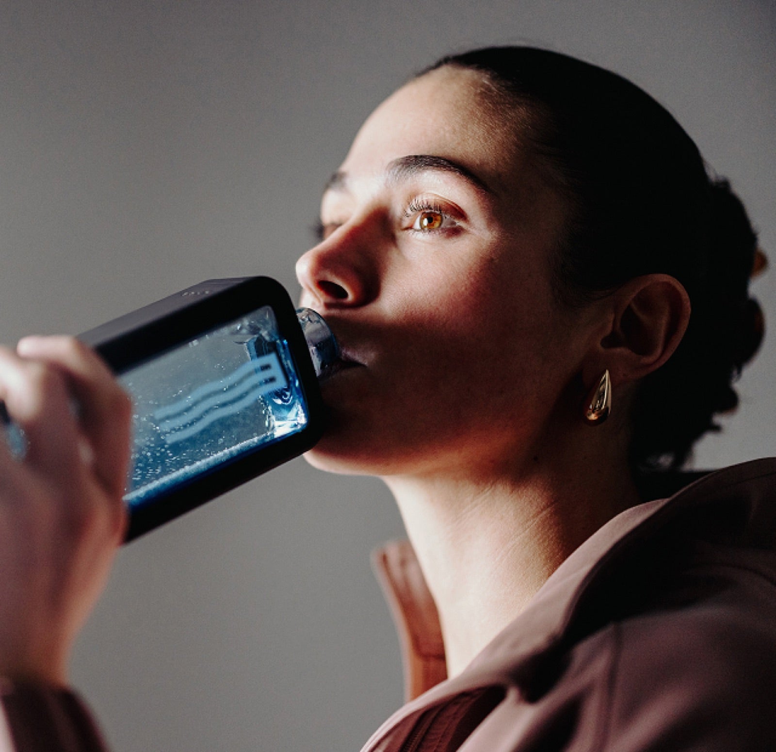 Woman drinking from the ECHO Flask